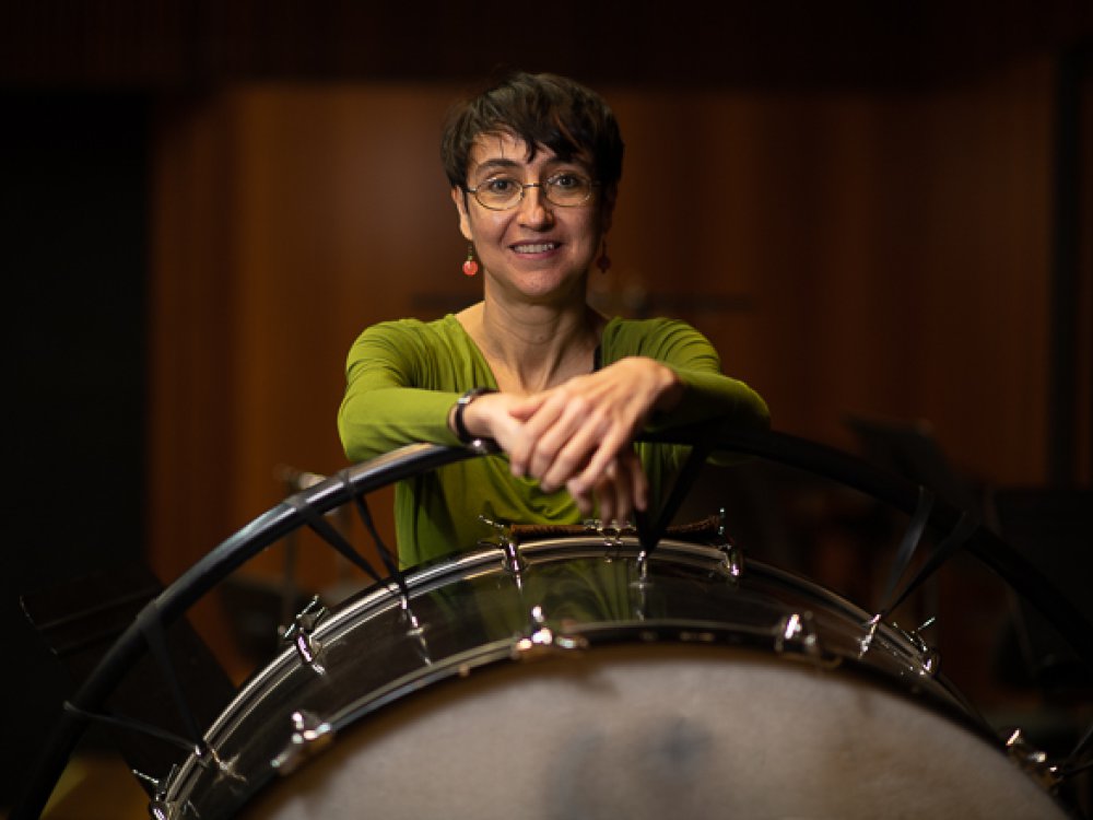 The composer Elena Mendoza with a bass drum